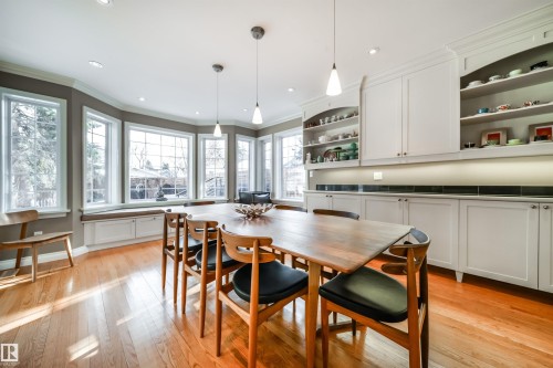 Dining area featuring light wood-style floors, ornamental molding, and recessed lighting - 10445 134 Street, Edmonton, AB - Indoor Photo Showing Dining Room
