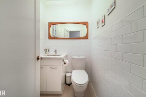 Bathroom with vanity and tile walls - 10445 134 Street, Edmonton, AB - Indoor Photo Showing Bathroom