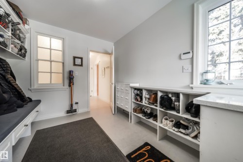 Mudroom featuring finished concrete flooring and plenty of natural light - 10445 134 Street, Edmonton, AB - Indoor Photo Showing Other Room