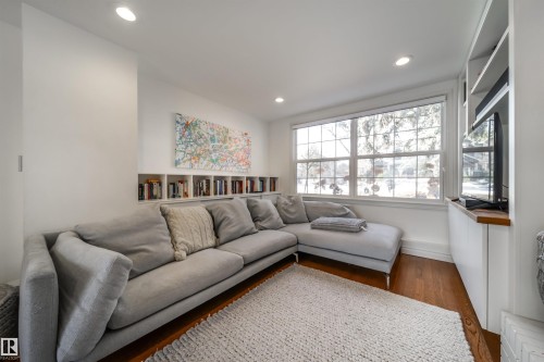 Living area with wood finished floors and recessed lighting - 10445 134 Street, Edmonton, AB - Indoor Photo Showing Living Room