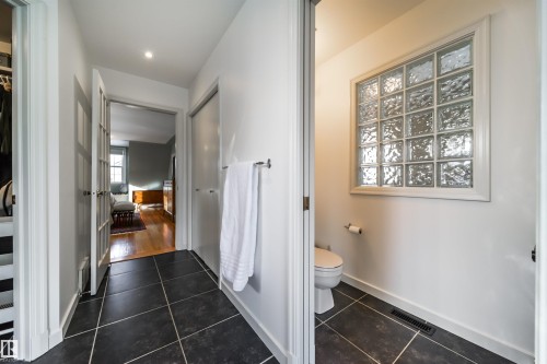 Ensuite bathroom with dark tile patterned flooring and recessed lighting - 10445 134 Street, Edmonton, AB - Indoor Photo Showing Other Room