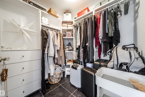 Walk in closet with dark tile patterned floors - 10445 134 Street, Edmonton, AB - Indoor With Storage