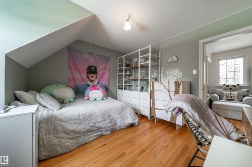 Bedroom featuring wood-type flooring and lofted ceiling - 10445 134 Street, Edmonton, AB - Indoor Photo Showing Bedroom