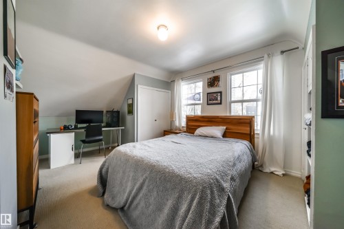 Bedroom featuring a desk, a closet, lofted ceiling, and carpet floors - 10445 134 Street, Edmonton, AB - Indoor Photo Showing Bedroom