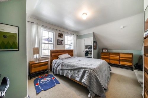 Carpeted bedroom with lofted ceiling and a closet - 10445 134 Street, Edmonton, AB - Indoor Photo Showing Bedroom