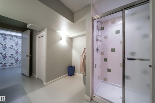 Bathroom with concrete flooring and a stall shower - 10445 134 Street, Edmonton, AB - Indoor Photo Showing Bathroom