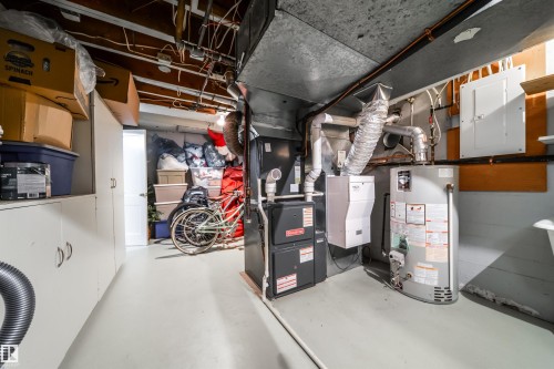 Utility room with electric panel and water heater - 10445 134 Street, Edmonton, AB - Indoor Photo Showing Basement