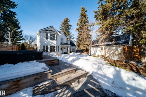 Snow covered back of property featuring a deck - 10445 134 Street, Edmonton, AB - Outdoor