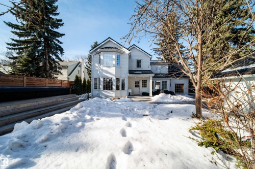 Snow covered back of property featuring a patio area - 10445 134 Street, Edmonton, AB - Outdoor