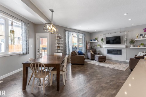7034 172A Avenue, Edmonton, AB - Indoor Photo Showing Dining Room With Fireplace