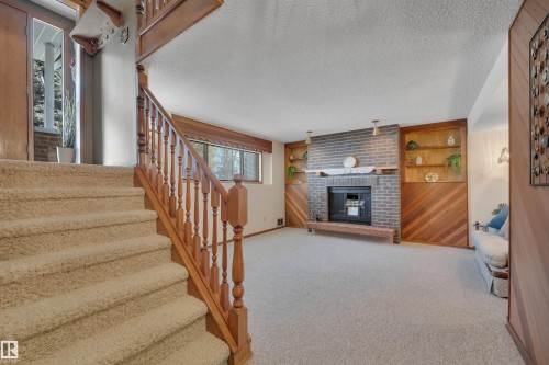 63 Alpaugh Crescent, Leduc, AB - Indoor Photo Showing Other Room With Fireplace