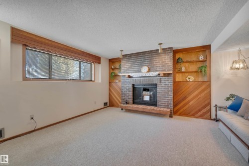 63 Alpaugh Crescent, Leduc, AB - Indoor Photo Showing Other Room With Fireplace