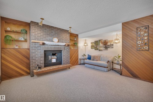 63 Alpaugh Crescent, Leduc, AB - Indoor Photo Showing Living Room With Fireplace