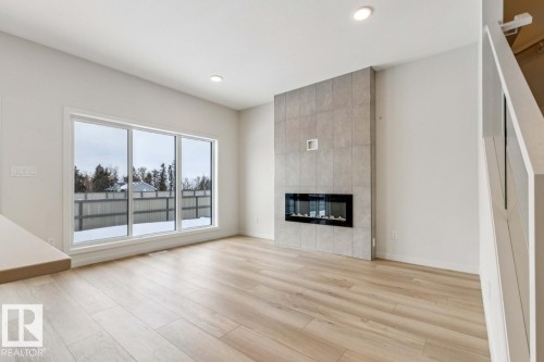 25 Stetson Loop, Ardrossan, AB - Indoor Photo Showing Living Room With Fireplace