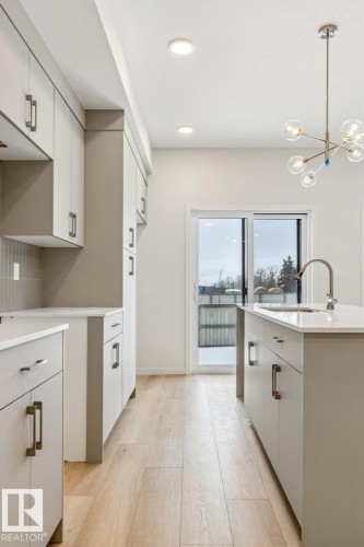 25 Stetson Loop, Ardrossan, AB - Indoor Photo Showing Kitchen With Double Sink