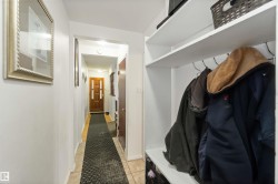 Mudroom with light tile patterned floors and baseboards - 
