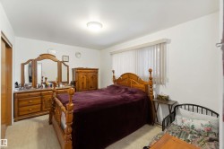 Bedroom with light colored carpet and a closet - 