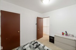 Bedroom featuring light carpet - 