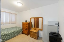 Bedroom with light colored carpet - 