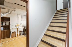 Staircase featuring tile patterned floors and washer / clothes dryer - 