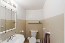 Bathroom featuring tile walls and wainscoting - 