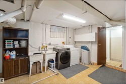 Washroom featuring light flooring and washer and clothes dryer - 