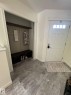 Entrance foyer with baseboards and light wood finished floors - 17703 65 Street, Edmonton, AB  - Indoor Photo Showing Other Room 