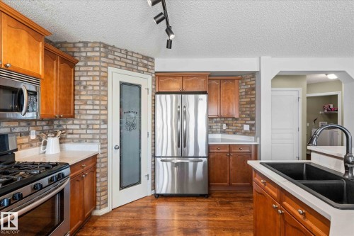 68 Greystone Crescent, Spruce Grove, AB - Indoor Photo Showing Kitchen With Double Sink