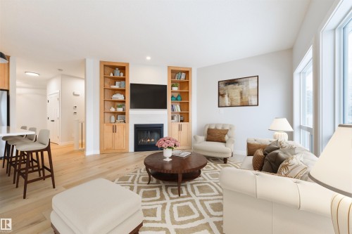 #23 1005 Calahoo Rd, Spruce Grove, AB - Indoor Photo Showing Living Room With Fireplace