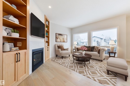 #23 1005 Calahoo Rd, Spruce Grove, AB - Indoor Photo Showing Living Room With Fireplace