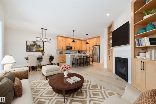 #23 1005 Calahoo Rd, Spruce Grove, AB - Indoor Photo Showing Living Room With Fireplace
