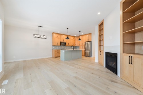 #23 1005 Calahoo Rd, Spruce Grove, AB - Indoor Photo Showing Other Room With Fireplace