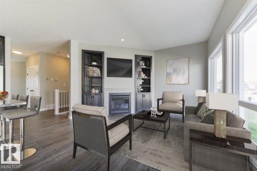 #86 1005 Calahoo Rd, Spruce Grove, AB - Indoor Photo Showing Living Room With Fireplace