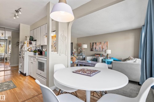 Dining area featuring light wood-type flooring - 304 11420 40 Avenue Nw, Edmonton, AB - Indoor Photo Showing Dining Room