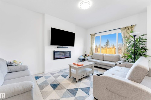 407 Conroy Crescent, Edmonton, AB - Indoor Photo Showing Living Room With Fireplace