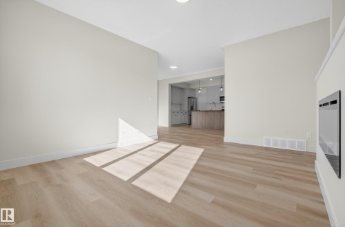 Unfurnished living room with light wood finished floors - 22 Grayson Green, Stony Plain, AB - Indoor Photo Showing Other Room