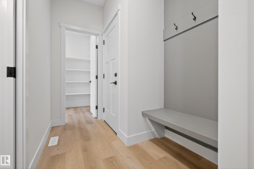 Mudroom featuring light wood-style floors and baseboards - 22 Grayson Green, Stony Plain, AB - Indoor Photo Showing Other Room