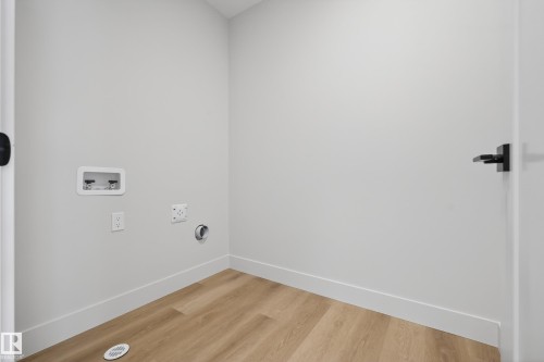 Laundry room featuring hookup for a washing machine and light wood finished floors - 22 Grayson Green, Stony Plain, AB - Indoor Photo Showing Other Room