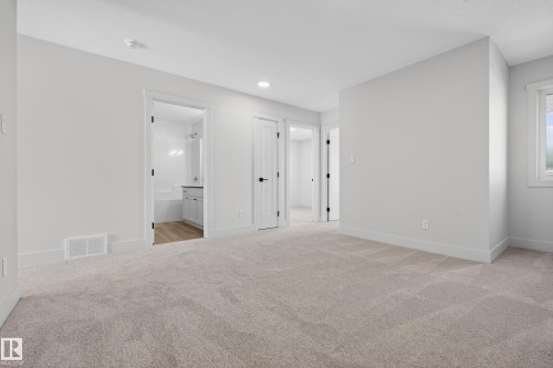 Unfurnished bedroom with light colored carpet and ensuite bathroom - 22 Grayson Green, Stony Plain, AB - Indoor Photo Showing Other Room