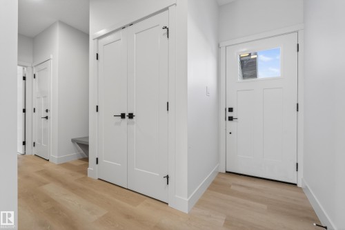 Entrance foyer with light wood finished floors and baseboards - 22 Grayson Green, Stony Plain, AB - Indoor Photo Showing Other Room