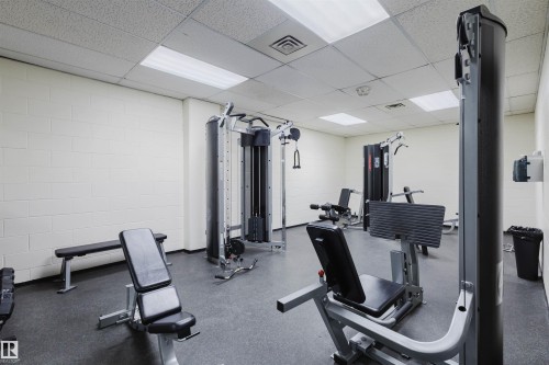 Workout area with a paneled ceiling - 1803 10149 Saskatchewan Drive, Edmonton, AB - Indoor Photo Showing Gym Room