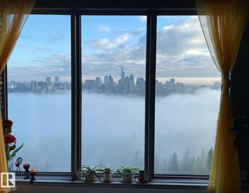 Expansive windows offer scenic views of the city skyline and natural landscape - 1803 10149 Saskatchewan Drive, Edmonton, AB -  Photo Showing Other Room With Body Of Water