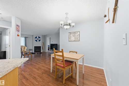 201 9640 105 Street, Edmonton, AB - Indoor Photo Showing Dining Room With Fireplace