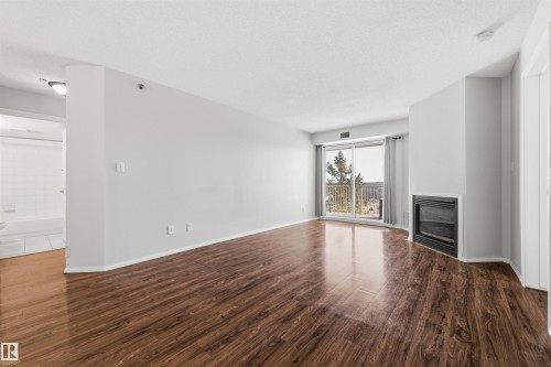 201 9640 105 Street, Edmonton, AB - Indoor Photo Showing Other Room With Fireplace