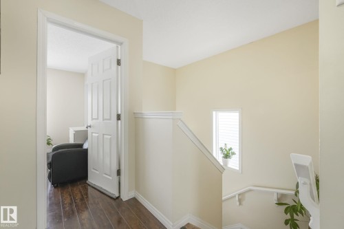 Corridor featuring an upstairs landing and dark wood-style flooring - 2348 28B Avenue, Edmonton, AB - Indoor Photo Showing Other Room