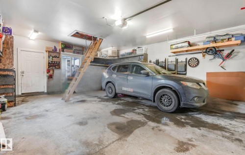 Garage with a garage door opener - 2348 28B Avenue, Edmonton, AB - Indoor Photo Showing Garage