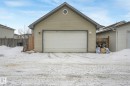 Snow covered garage featuring a garage - 2348 28B Avenue, Edmonton, AB  - Outdoor With Exterior 