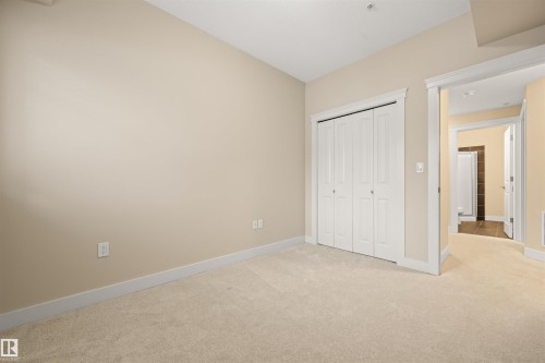 Unfurnished bedroom featuring light carpet and a closet - 29 11518 76 Avenue, Edmonton, AB - Indoor Photo Showing Other Room