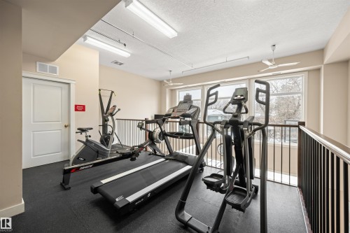 Gym featuring a textured ceiling and ceiling fan - 29 11518 76 Avenue, Edmonton, AB - Indoor Photo Showing Gym Room