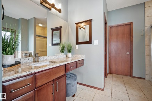 Bathroom featuring vanity, light tile patterned floors, and a stall shower - 19 Rosemount Boulevard, Beaumont, AB - Indoor Photo Showing Bathroom